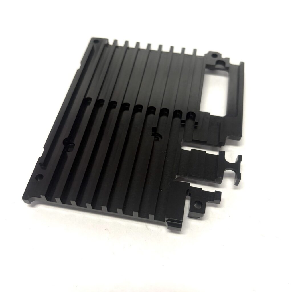 Custom black plastic heatsink frame with parallel cooling fins – front view